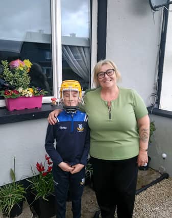 Zack Hannigan with his grandmother Robbie in his new helmet.