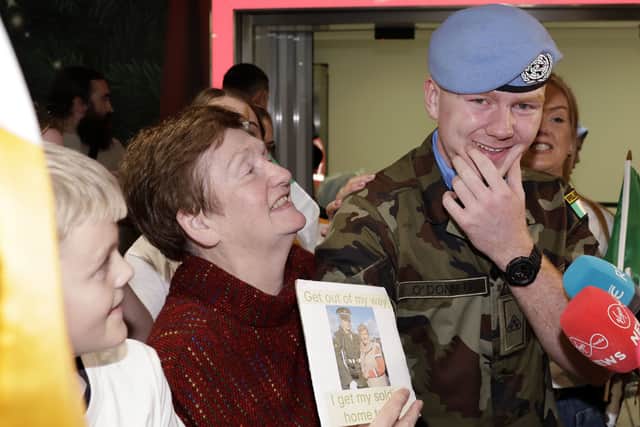 The family of Paddy O’Donnell, who turned 21 on Sunday, sang Travelin’ Soldier as they waited for peacekeepers to land back in Dublin.