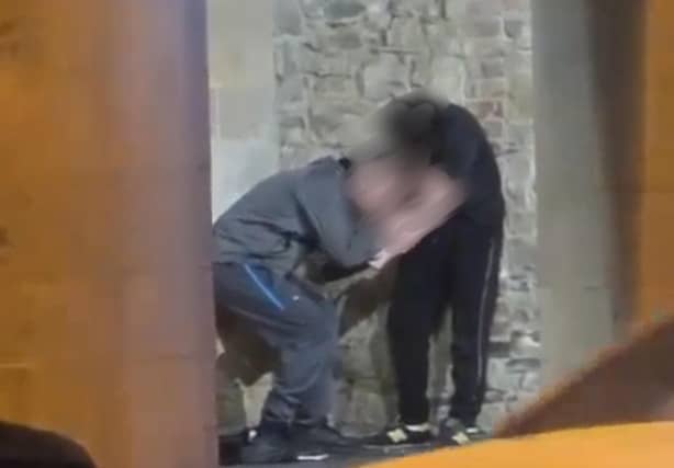An image from a video circulating of two men 'shooting up' drugs at the Main Guard in Clonmel