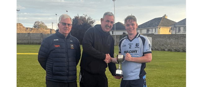 Moyle Rovers captain Conor O’Gorman receives the cup from Fintan O’Connor. Also included is Nicholas Moroney, Chairman of the South Tipperary GAA Board