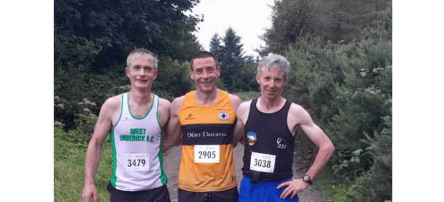 Barry Hartnett, Dundrum AC (centre), the winner of the IMRA Templehill Race on Sunday. Also pictured are second and third, Sean Quirke and John Paul O’Connell