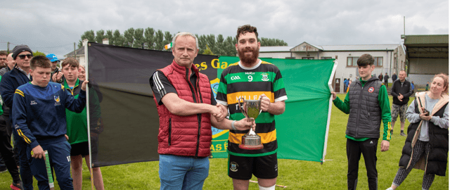 Thurles Gaels captain Anthony Cooney receives the cup from David Tierney following their victory over Knockshegowna. Picture: Sportsfocus