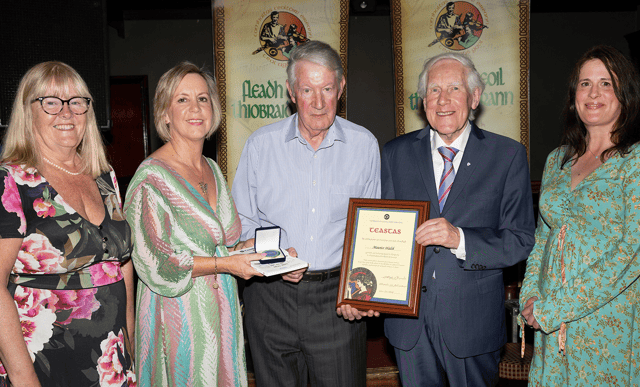 Maurice Walsh receiving his award from Dr Murch