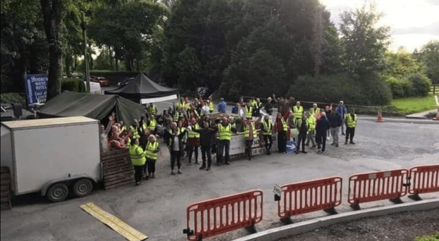 Protestors at the gate of Dundrum House Hotel