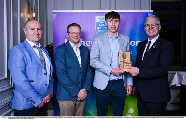 University of Limerick player Gearoid O'Connor, centre, is presented with the 2025 Electric Ireland Higher Education GAA Hurling Rising Stars Player of the Year award