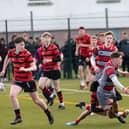 Clonmel High School's Sam Maher tackles his Glenstal Abbey opponent, with Cailean Morrison and Matthew Ryan in support. Picture: John D Kelly