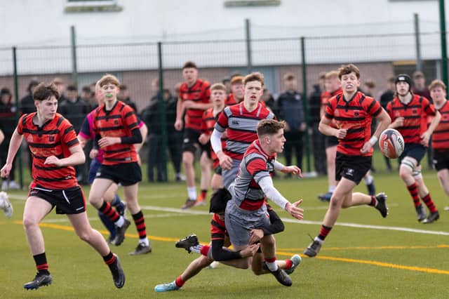 Clonmel High School's Sam Maher tackles his Glenstal Abbey opponent, with Cailean Morrison and Matthew Ryan in support. Picture: John D Kelly