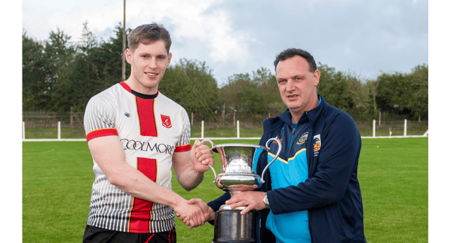 Fearghal McDonnell, Chairman of the County Football Committee, presents the Tom Cusack Cup to Killenaule captain Paudie Feehan. Picture: Michael Boland