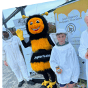Mick McGrath, young beekeeper Ryan Lonergan and Paul Lonergan with the Honey Queen