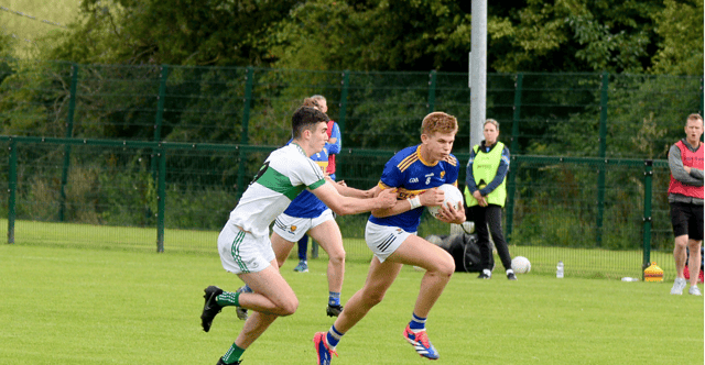 Micheál Freaney, Kilsheelan Kilcash, bursts past Grangemockler Ballyneale's Ben Comerford. Picture: Michael Boland
