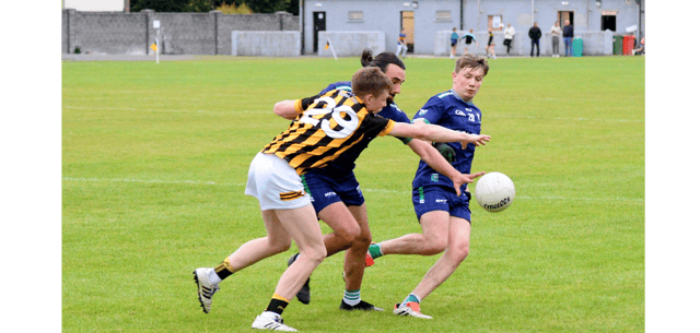 Jim O'Dwyer, Upperchurch Drombane (number 29) and Cahir's Eddie Kendrick in a battle for possession. On the right is Cahir's Nicholas Reidy. Picture: Michael Boland