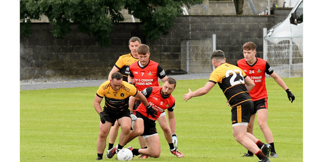Paddy Dalton, Arravale Rovers (left) and Ballyporeen's James Barry in a scrap for possession. Picture: Michael Boland