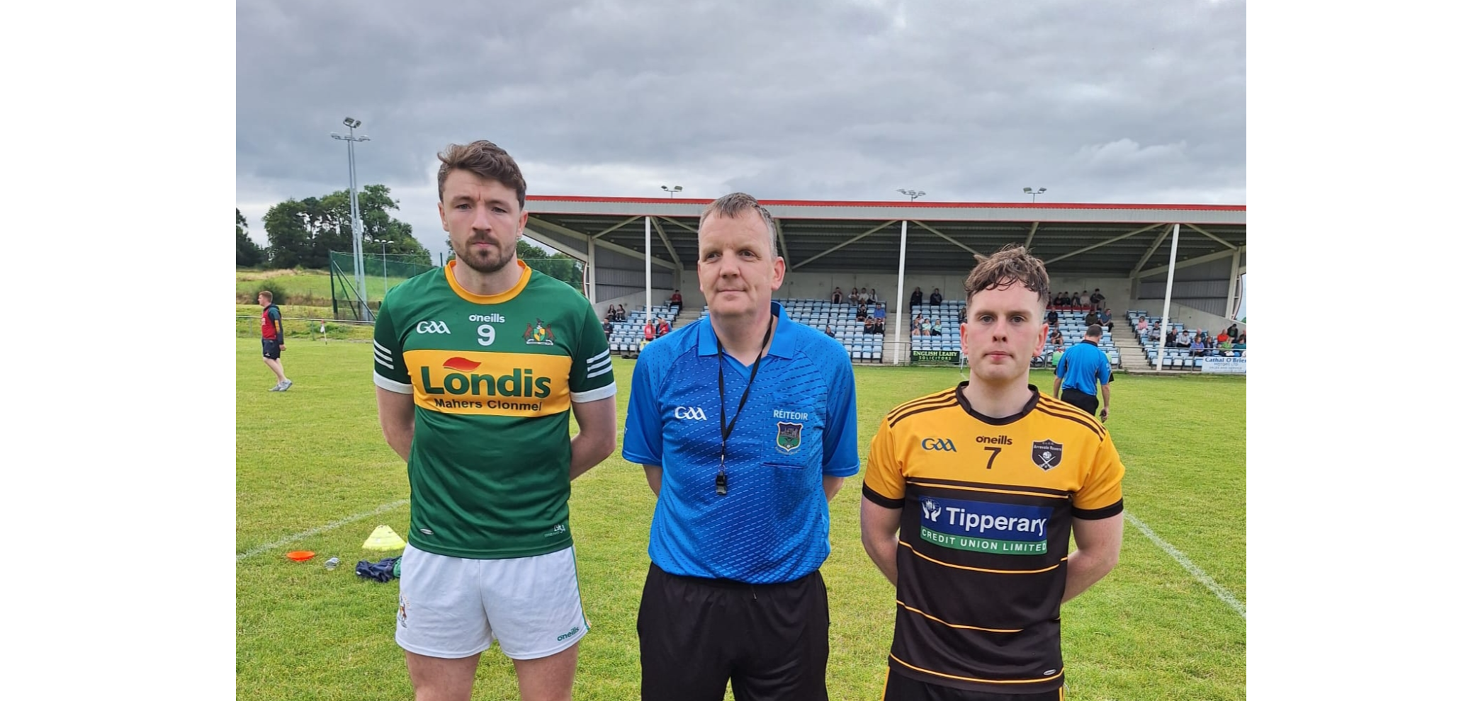 Captains Jack Kennedy, Clonmel Commercials (left) and Tommy Lowry, Arravale Rovers, with referee Jonathan Cullen