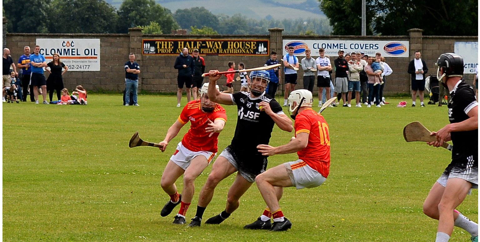 Carrick Swan's Eric O'Halloran is surrounded by Killenaule's Killian O'Dwyer (left) and Joe O'Dwyer during the Clonmel Oil South Tipperary Senior Hurling final. Picture: Michael Boland