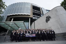 Criminal barristers take part in a demonstration outside the Criminal Courts of Justice in Dublin as they withdraw services amid ongoing fees dispute (Niall Carson/PA)