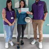 Cliona O’Dwyer being presented with a cheque by Resilience Healthcare’s Commercial Director Ed O’Brien alongside Service Manager Agnes McCahill at Resilience’s new residential service in Dundrum.