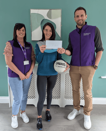 Cliona O’Dwyer being presented with a cheque by Resilience Healthcare’s Commercial Director Ed O’Brien alongside Service Manager Agnes McCahill at Resilience’s new residential service in Dundrum.