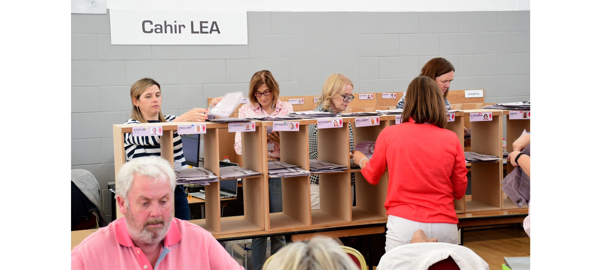 Staff at the count centre in Thurles sort through the votes from  Cahir