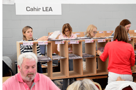 Staff at the count centre in Thurles sort through the votes from  Cahir