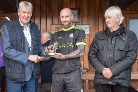 Man of the Match in last Saturday's Tipperary Cup, Philip Drohan (Clonmel Celtic) accepts his award from John Quirke, Jeweller, Cahir. On right is Liam Clohessy, Chairman TS&DL. Pic: Michael Boland
