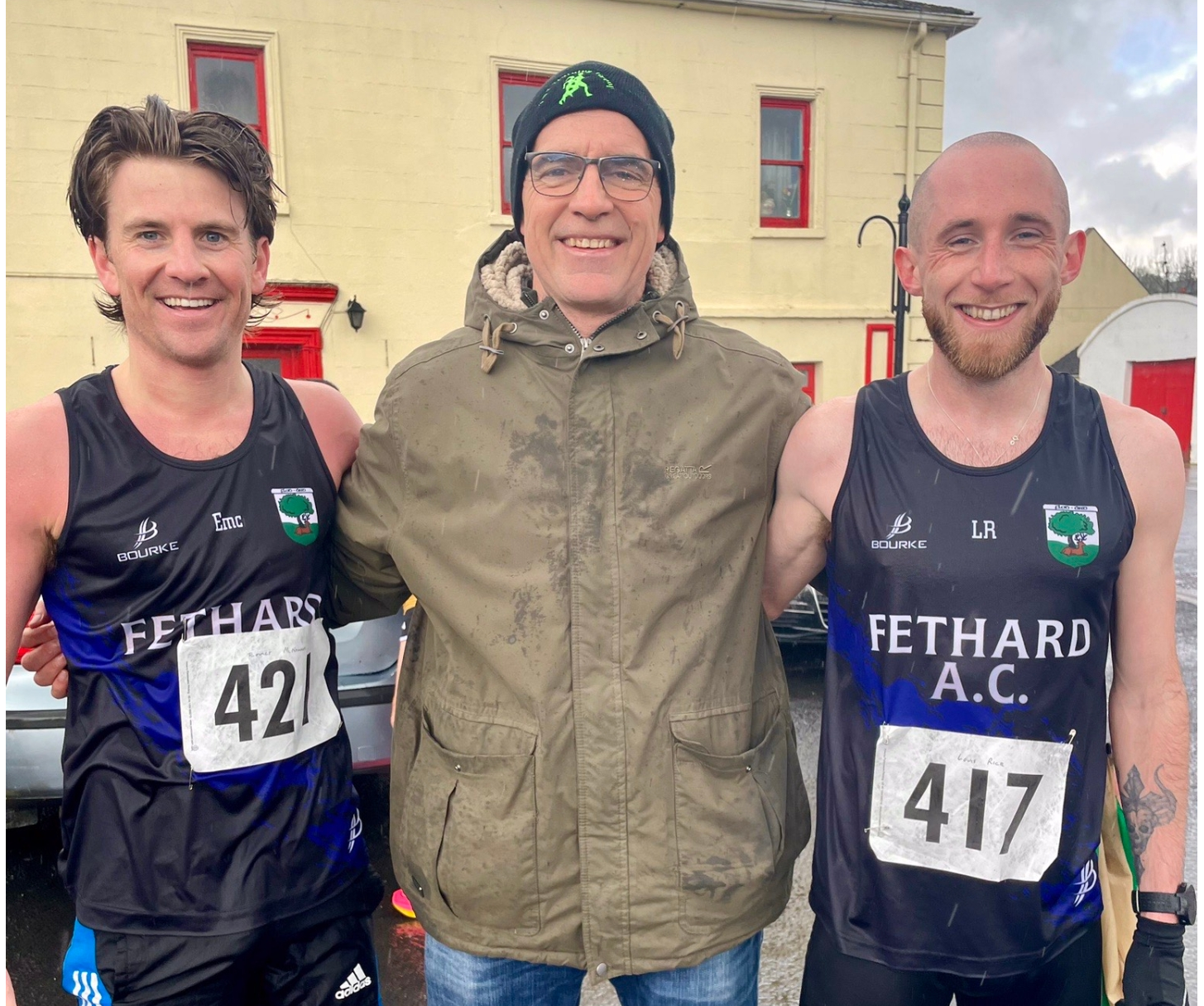 Fethard AC coach John Laste pictured with Emmet McNamara (1st) and Louis Rice (2nd) after the County Intermediate Road Championships held in Galbally on Sunday last.