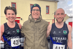 Fethard AC coach John Laste pictured with Emmet McNamara (1st) and Louis Rice (2nd) after the County Intermediate Road Championships held in Galbally on Sunday last.