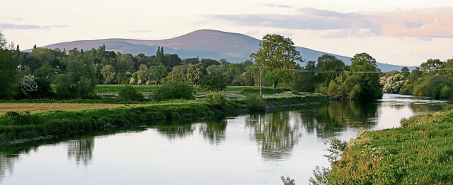 The Suir at Sandybanks upriver from Clonmel with Slievenamon in the background. Clonmel Rowing Club fully appreciates the value of the Suir as an amenity.