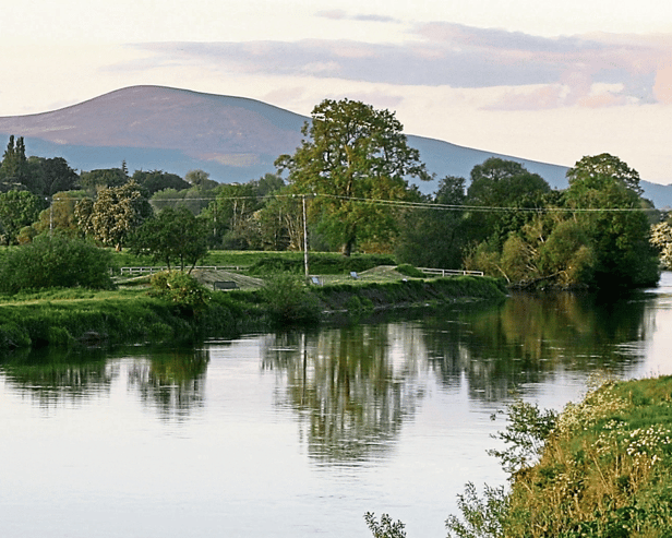 The Suir at Sandybanks upriver from Clonmel with Slievenamon in the background. Clonmel Rowing Club fully appreciates the value of the Suir as an amenity.