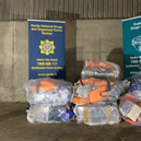 Detector dog Harley with the cocaine seized on a ship in Foynes Port