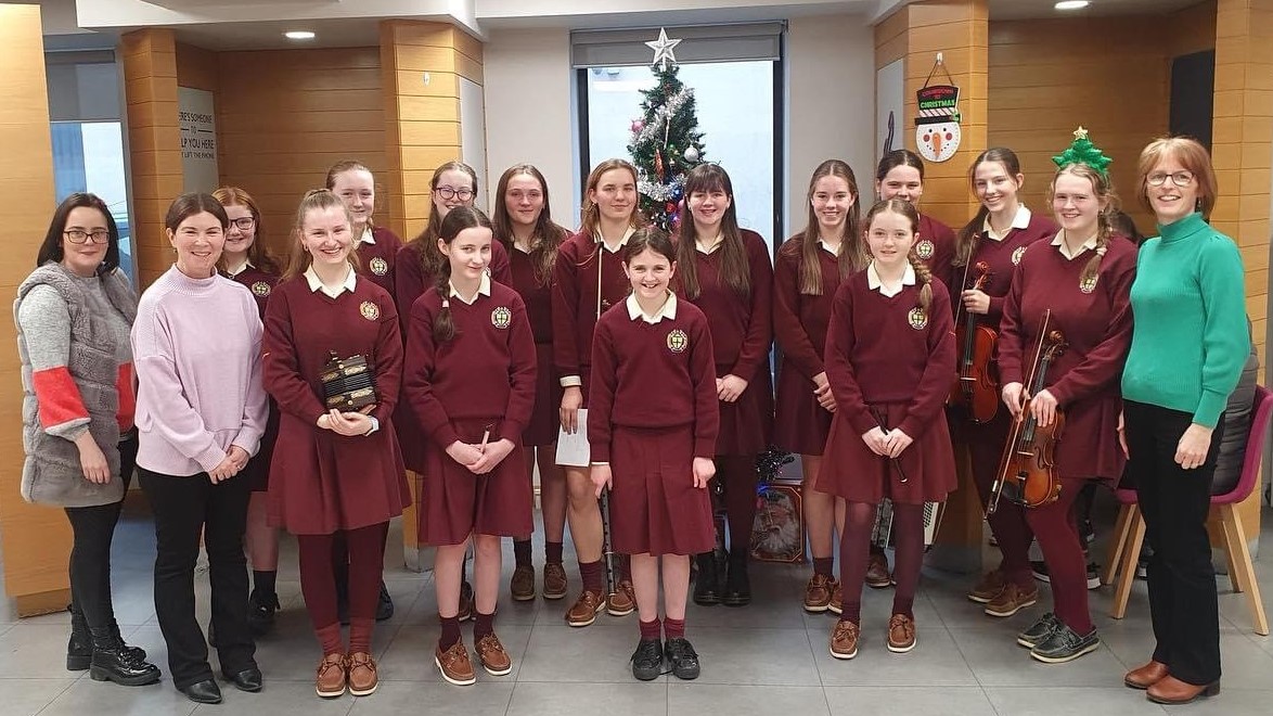 Tipperary school's trad group entertain customers at local bank