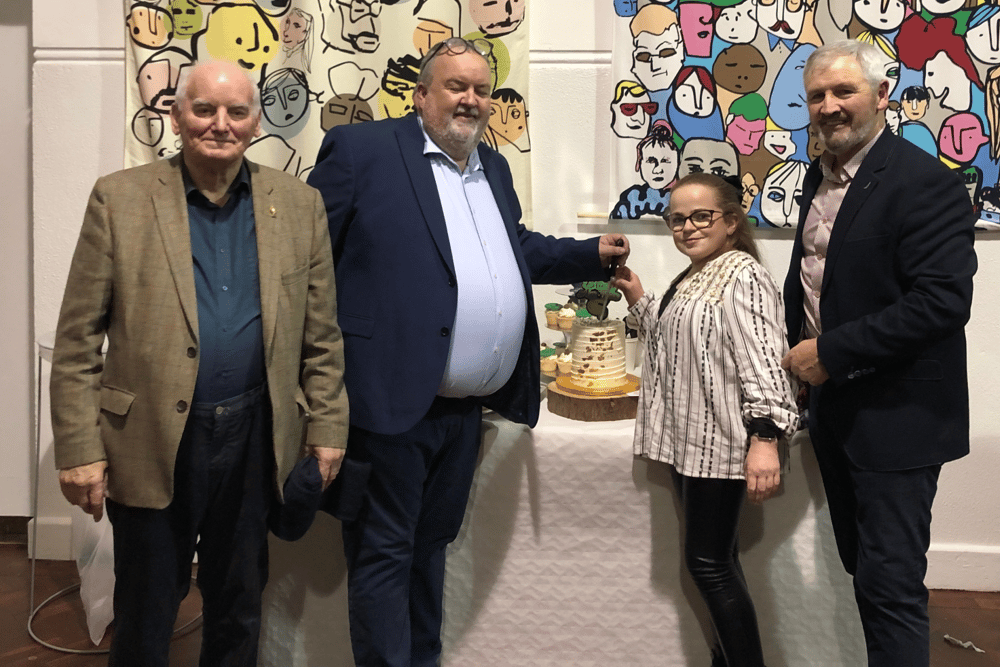 Mathúin Ó Caoimh, John McCarthy, Méabh Purcell (former student who made the  anniversary cake) and Charlie McGeever. Méabh and John did the duties of cutting the fabulous cáca milis.