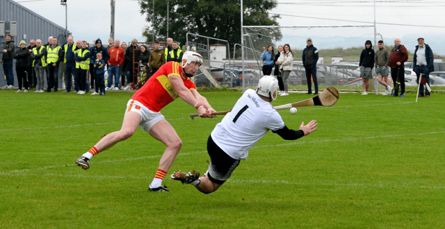 Carrick Swan goalkeeper Kieran Lonergan makes a great save from Killenaule's Mark Stakelum. Picture: Michael Boland