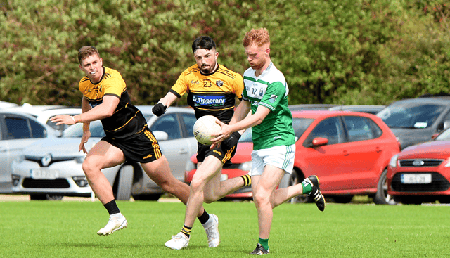 Cahir's Jake Kiely breaks away from Niall Sharpe, Arravale Rovers. Picture: Michael Boland