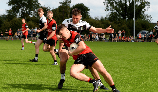 Ballyporeen's Darragh Brennan is tackled by Tom Murphy, JK Brackens. Picture: Michael Boland