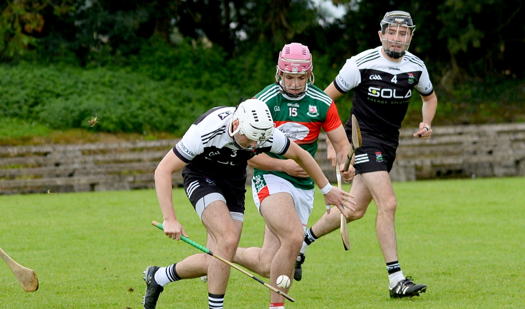 Mullinahone's Mikey O'Shea closes in on JK Brackens' Tom Murphy during Sunday's game in Cashel. Picture: Michael Boland