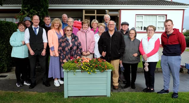 Brian King ( CEO Thurles Credit Union ) and Amanda Ryan ( Chairperson Thurles Credit Union) with Moyne Road Residents last week to celebrate the arrival of the 8 new planters.