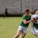 Grangemockler/Ballyneale's Alex Millea holds onto the ball despite the challenge of Aherlow's Diarmuid Looby. Picture: Michael Boland