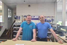 Cathal Gill and Liam Leamy at the front desk in Drombane