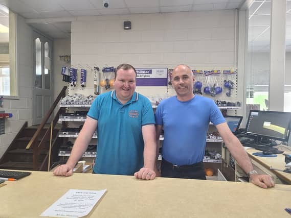 Cathal Gill and Liam Leamy at the front desk in Drombane