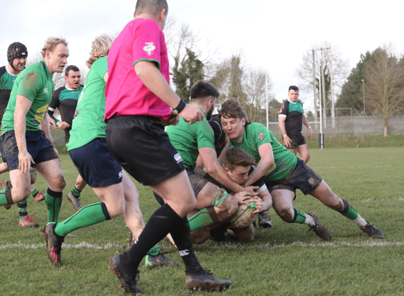 Under pressure, Rob Wynne touches down for Clonmel against Ballina in the 48th minute