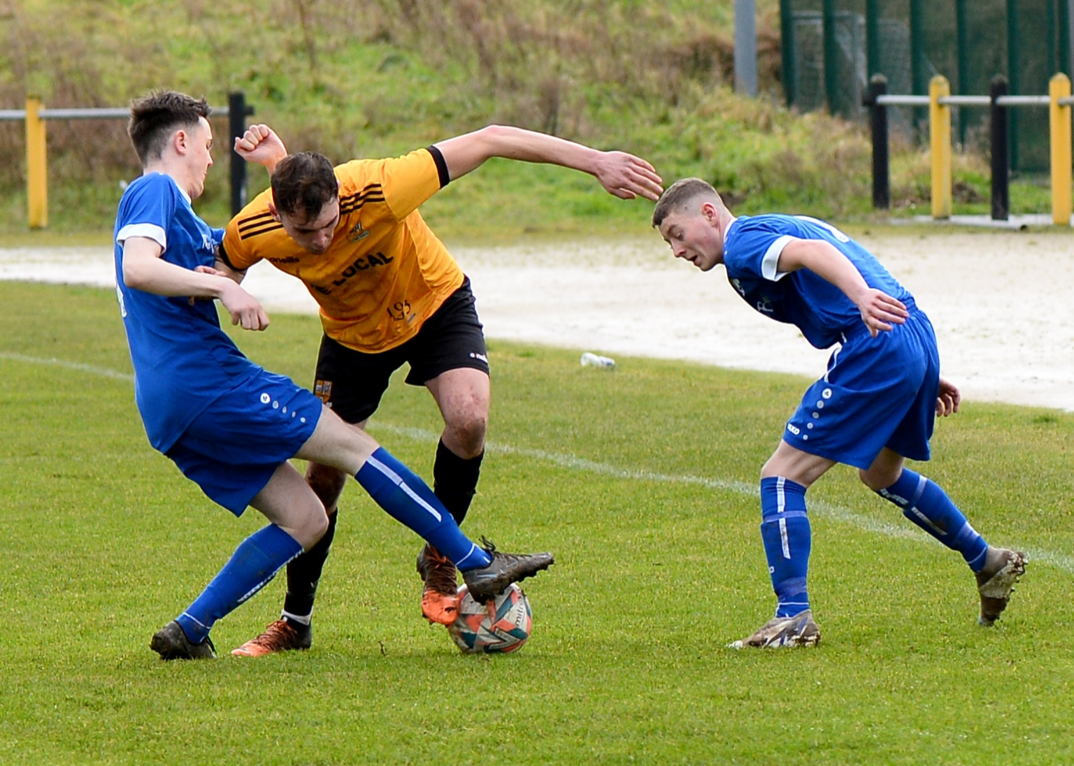 Clonmel Town’s Daryl Hanrahan tries to thread the ball past two Cashel Town players during Sunday’s Clonmel Credit Union Premier League game between the sides. Pic: Michael Boland