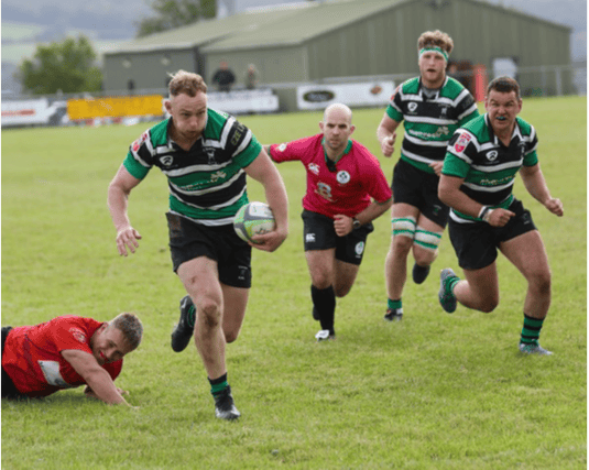 Andrew Daly on way to scoring Clonmels second try supported by Jack Lonergan and Alex Sheehan