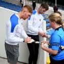 Tipperary players Jason Forde and Barry Heffernan  sign autographs at the big day