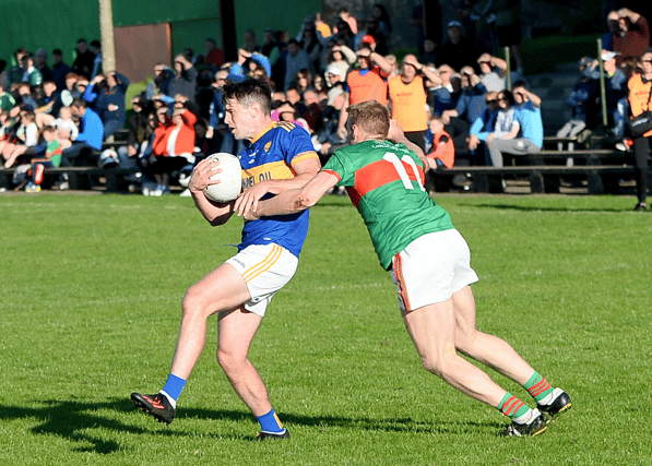 Martin Gibbs, Kilsheelan/Kilcash, holds onto the ball despite the challenge of Loughmore/Castleiney's Brian McGrath. Picture: Michael Boland