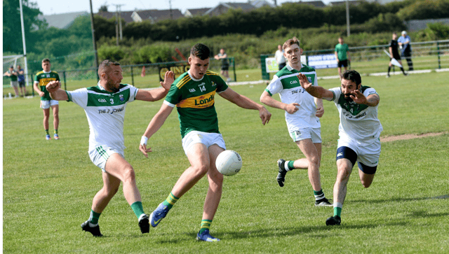 Clonmel Commercials’ full-forward Darragh O'Connor gets his shot off despite the best efforts of Gerard Halley (Cahir) with an attempted block. Pic: Michael Boland