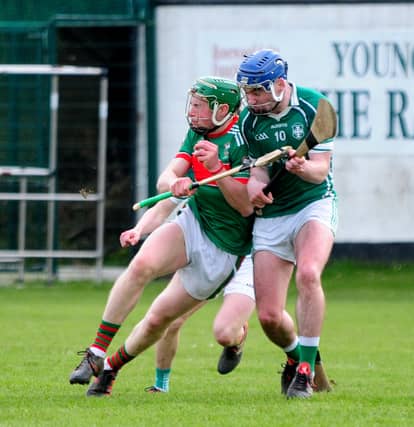 Brian McGrath (Loughmore-Castleiney) pictured absorbing a thundering shoulder from Holycross-Ballycahill's Jack Skehan at The Ragg on Saturday afternoon. Picture: Eamonn McGee