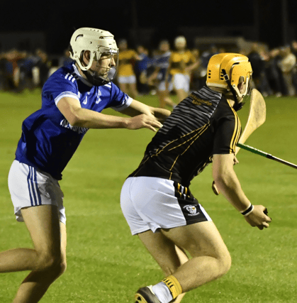 Dean Cagney of St Mary's challenges Knockavilla Donaskeigh Kickhams goalkeeper Jack Breen during last night's county I9 A hurling semi-final at Dr Morris Park, Thurles. Picture: Michael Boland