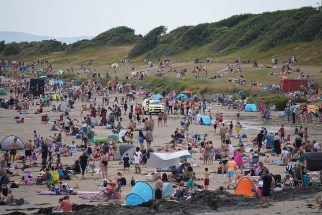 Criticism has been levelled at those who left empty beer bottles, cans and plastic strewn around Burrow Beach in Sutton on Tuesday morning, after images were shared online by a professional photographer.