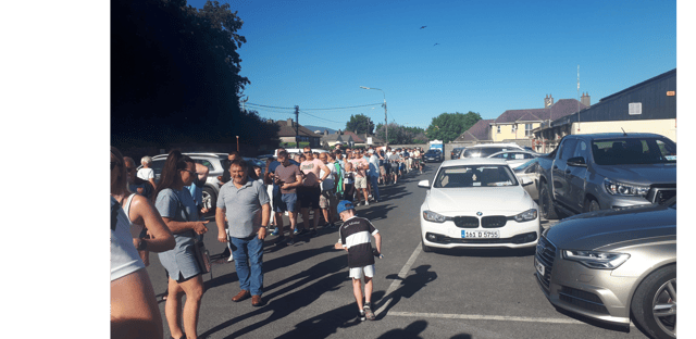 Long queues formed outside Clonmel Sportsfield twenty minutes before the south hurling final throw -in and the start had to be delayed by five minutes to allow the crowd enter the ground