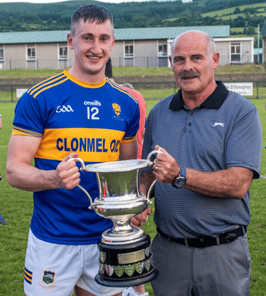 Kilsheelan/Kilcash captain Mark Kehoe accepts the Martins Tiles South Tipperary Intermediate Hurling Championship cup from South Board chairman Seamus Mullins after Kilsheelan defeated Ballingarry.